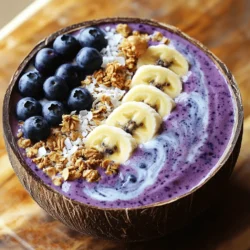Die Hauptzutaten sind wichtig für den Geschmack und die Nährstoffe. Hier sind die Zutaten, die du brauchst: - 1 Tasse gefrorene Blaubeeren - 1 reife Banane - 1/2 Tasse Kokosmilch (oder eine Nussmilch nach Wahl) - 1 Esslöffel Chiasamen - 1 Esslöffel Kokosraspeln - 1 Esslöffel Ahornsirup (optional, für zusätzliche Süße) Diese Zutaten machen die Smoothie-Bowl cremig und voller Geschmack. Die gefrorenen Blaubeeren geben eine schöne Farbe und sind reich an Antioxidantien. Die Banane sorgt für eine süße Basis und eine tolle Textur. Du kannst die Bowl mit zusätzlichen Zutaten aufwerten. Hier sind einige Tipps: - Frische Blaubeeren - In Scheiben geschnittene Banane - Granola - Weitere Kokosraspeln - Nüsse nach Wahl (z.B. Mandeln, Walnüsse) Diese Ergänzungen bringen noch mehr Nährstoffe. Sie fügen Ballaststoffe, gesunde Fette und Proteine hinzu. So wird dein Frühstück noch sättigender und gesünder. Die Qualität der Zutaten macht einen großen Unterschied. Achte auf Folgendes: - Wähle frische oder gefrorene Früchte ohne Zuckerzusatz. - Verwende Bio-Kokosmilch, wenn möglich, für besseren Geschmack. - Kaufe hochwertige Chiasamen und Nüsse, um die besten Nährstoffe zu bekommen. Gute Zutaten garantieren ein besseres Ergebnis. Wenn du die besten Zutaten wählst, wird deine Blaubeer-Kokos-Smoothie-Bowl noch leckerer. Du kannst das vollständige Rezept finden, um alle Schritte zu sehen. Zuerst sammeln wir alle Zutaten. Du benötigst: - 1 Tasse gefrorene Blaubeeren - 1 reife Banane - 1/2 Tasse Kokosmilch - 1 Esslöffel Chiasamen - 1 Esslöffel Kokosraspeln - 1 Esslöffel Ahornsirup (optional) - Toppings: frische Blaubeeren, geschnittene Banane, Granola, Kokosraspeln und Nüsse Wasche die frischen Früchte gut. Die gefrorenen Blaubeeren sind perfekt. Sie geben der Bowl die Kühle und einen tollen Geschmack. Die Banane sollte reif sein. Reife Bananen sind süßer und cremiger. Gib die vorbereiteten Zutaten in den Mixer. Stelle den Mixer auf hohe Stufe ein. Mixe die Mischung, bis sie glatt und cremig ist. Manchmal musst du die Seiten des Mixers abkratzen, um alles gut zu vermengen. Wenn die Mischung zu dick ist, füge mehr Kokosmilch hinzu. Probiere den Smoothie. Wenn du es süßer magst, kannst du mehr Ahornsirup hinzufügen. Mixe erneut, bis alles gut vermischt ist. Gieße den Smoothie in eine Schüssel. Verwende einen Löffel, um eine schöne Oberfläche zu erstellen. Das gibt einen tollen Look. Jetzt kommt der spaßige Teil: das Dekorieren! Garnieren die Bowl mit frischen Blaubeeren, geschnittenen Bananen und Granola. Eine Prise Kokosraspeln sorgt für extra Geschmack. Nüsse geben einen schönen Crunch. Serviere die Smoothie-Bowl sofort. Du kannst auch etwas Kokosmilch um den Rand der Schüssel träufeln. Das sieht schön aus und schmeckt lecker! Für das vollständige Rezept, schau dir den Abschnitt "Full Recipe" an. Lass dir deine Blaubeer Kokos Smoothie Bowl schmecken! Ein häufiger Fehler ist, zu viele frische Zutaten zu verwenden. Gefrorenes Obst sorgt für eine dickere, cremigere Konsistenz. Achte darauf, die gefrorenen Blaubeeren und die Banane zuerst hinzuzufügen. Mixe alles auf hoher Stufe. Wenn die Mischung zu dick ist, füge etwas mehr Kokosmilch hinzu. Teste den Smoothie, um sicherzustellen, dass er die richtige Süße hat. Die Süße ist wichtig für den Geschmack. Wenn du es süßer magst, füge mehr Ahornsirup hinzu. Du kannst auch Honig oder Agavendicksaft verwenden. Probiere es aus, um die perfekte Balance zu finden. Beginne mit einem Esslöffel und füge mehr nach Bedarf hinzu. So hast du die Kontrolle über die Süße deiner Smoothie-Bowl. Wenn du gefrorene Früchte verwendest, achte darauf, dass sie frisch sind. Überprüfe das Verfallsdatum und die Verpackung. Lasse die Früchte nicht zu lange im Gefrierschrank. Sie verlieren ihren Geschmack. Verwende die gefrorenen Blaubeeren direkt aus dem Gefrierschrank. So bleiben sie fest und sorgen für eine tolle Textur im Smoothie. {{image_4}} Du kannst die Blaubeeren durch viele andere Früchte ersetzen. Probiere Erdbeeren, Himbeeren oder Mango. Diese Früchte bringen eigene Aromen mit. Sie sind auch sehr gesund. Eine Mischung aus verschiedenen Beeren ist ebenfalls lecker. So bleibt die Bowl bunt und voller Geschmack. Die Blaubeer-Kokos-Smoothie-Bowl ist von Natur aus vegan und glutenfrei. Du kannst die Kokosmilch durch jede pflanzliche Milch ersetzen. Mandelmilch oder Hafermilch sind gute Alternativen. Alle diese Optionen sind frei von tierischen Produkten und Gluten. Achte darauf, dass deine Toppings auch vegan und glutenfrei sind. Toppings machen deine Smoothie-Bowl einzigartig. Du kannst frische Früchte, Nüsse oder Samen verwenden. Granola gibt einen tollen Crunch dazu. Probiere auch Kokosflocken oder Erdnussbutter. Diese Optionen sind sehr nahrhaft. Sie bieten viele Vitamine und Mineralien. Wenn du es süßer magst, füge Honig oder Agavendicksaft hinzu. Um die Blaubeer-Kokos-Smoothie-Bowl frisch zu halten, legen Sie sie in einen luftdichten Behälter. Stellen Sie sicher, dass die Bowl gut verschlossen ist. Im Kühlschrank bleibt sie für bis zu zwei Tage frisch. Vor dem Servieren einfach gut umrühren. Wenn Sie die Smoothie-Bowl für später aufbewahren möchten, frieren Sie sie ein. Gießen Sie die Mischung in einen gefrierfesten Behälter oder in Eiswürfelformen. So können Sie kleine Portionen einfach entnehmen. Zum Auftauen lassen Sie die Bowl einfach im Kühlschrank. Sie können sie auch kurz bei Raumtemperatur stehen lassen. Die Hauptzutaten haben unterschiedliche Haltbarkeiten: - Gefrorene Blaubeeren: bis zu einem Jahr im Gefrierschrank. - Reife Banane: etwa zwei bis drei Tage bei Raumtemperatur. - Kokosmilch: ungeöffnet bis zu einem Jahr, geöffnet etwa eine Woche im Kühlschrank. - Chiasamen: bis zu zwei Jahre, wenn trocken gelagert. - Kokosraspeln: etwa ein Jahr, wenn kühl und trocken gelagert. - Ahornsirup: unbegrenzt, wenn gut verschlossen. Achten Sie darauf, die Zutaten rechtzeitig zu verwenden, um den besten Geschmack zu erhalten. Wenn Sie mehr über die Zubereitung erfahren möchten, schauen Sie sich das Full Recipe an. Um die Smoothie-Bowl dicker zu machen, gibt es einige einfache Tricks. - Verwende gefrorene Früchte: Gefrorene Blaubeeren und Bananen helfen, die Konsistenz zu erhöhen. - Füge mehr Chiasamen hinzu: Diese kleinen Samen quellen und machen die Mischung dick. - Reduziere die Flüssigkeit: Weniger Kokosmilch oder Nussmilch macht die Bowl fester. Wenn du diese Tipps befolgst, bekommst du eine schöne, dicke Konsistenz. Es macht Spaß, mit verschiedenen Zutaten zu experimentieren. Ja, du kannst verschiedene Milchsorten verwenden. - Mandelmilch: Sie hat einen milden Geschmack und ist leicht. - Hafermilch: Sie gibt eine cremige Textur. - Sojamilch: Diese hat einen hohen Proteingehalt. Wähle die Milch, die dir am besten schmeckt oder die du gerade zur Hand hast. Es gibt viele Optionen, die gut passen. Auf jeden Fall ist die Smoothie-Bowl ein tolles Frühstück! - Schnell zubereitet: Sie braucht nur fünf Minuten. - Vollgepackt mit Nährstoffen: Die Zutaten bieten Vitamine und Ballaststoffe. - Kreativ anpassbar: Du kannst sie nach deinem Geschmack gestalten. Genieße sie als leckeres und gesundes Frühstück. Du kannst auch die [Full Recipe] für die Zubereitung verwenden. Die Blaubeer-Kokos-Smoothie-Bowl bietet viele Vorteile. Wir haben die wichtigsten Zutaten, die Zubereitung und Tipps besprochen. Variationen und Lagerungshinweise helfen, kreative Ideen zu finden. Denke daran, die Zutaten frisch und von guter Qualität zu wählen. Experimentiere mit Toppings und Süße, ganz nach deinem Geschmack. So kannst du jede Bowl einzigartig machen. Genieße deine gesunde Mahlzeit und lass deiner Kreativität freien Lauf!